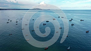 Aerial view of many wooden Vietnamese traditional fisherman boats on the sea