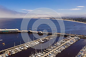 Aerial view of many yachts docked by the coastline in Monterey Bay Aquarium, in central California