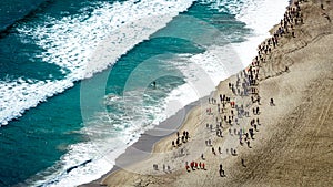Aerial view of a marathon across the beach. From the top of Mount Maunganui Tauranga, Bay of Plenty. New Zealand.