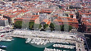 Aerial view of marine port and harbor with luxury yachts in Port de Nice in France in a summer sunny day. Action. Top