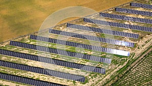 Aerial view, massive Solar panel farm on the field, alternative energy