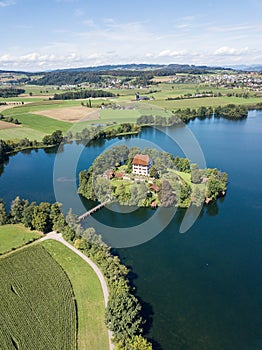 Aerial view of the Mauern Lake with an old, little castle on the small island