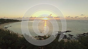 Aerial view of Mauritius coast and sunset over the ocean