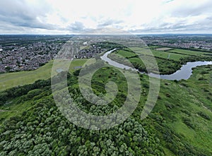 Aerial view of a meander of the River Mersey in Warrington, Cheshire with Paddington Meadows behind