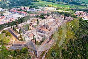 Aerial view of medieval Castle on hilltop in Spanish village of Hostalric photo