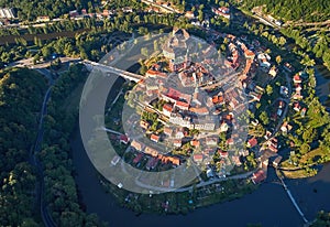 Aerial view of medieval Loket city with Castle, Burg Elbogen, gothic style castle on rocky cliff above river Ohre.