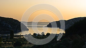 Aerial view of mediterranean coast around Porto Koufo harbor at sunset