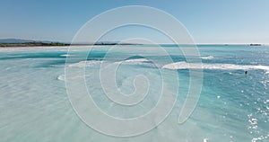 Aerial view of Mediterranean sea. Stand up paddle surfer. Men on Surf board