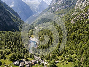 Aerial view of the Mello Valley, a valley surrounded by granite mountains and forest trees, renamed the little italian Yosemite