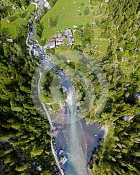 Aerial view of the Mello Valley, a valley surrounded by granite mountains and forest trees, renamed the little italian Yosemite