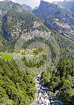 Aerial view of the Mello Valley, a valley surrounded by granite mountains and forest trees, renamed the little italian Yosemite