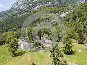 Aerial view of the Mello Valley, a valley surrounded by granite mountains and forest trees, renamed the little italian Yosemite