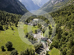 Aerial view of the Mello Valley, a valley surrounded by granite mountains and forest trees, renamed the little italian Yosemite