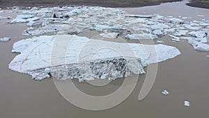 Aerial view of melting glacier and floating icebergs as result of Atlantic ocean meridional overturning circulation collapse