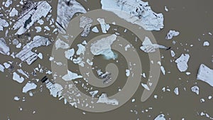 Aerial view of melting glacier and floating icebergs as result of Atlantic ocean meridional overturning circulation collapse