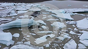 Aerial view of melting glacier and floating icebergs as result of Atlantic ocean meridional overturning circulation collapse