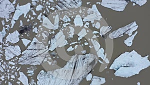 Aerial view of melting glacier and floating icebergs as result of Atlantic ocean meridional overturning circulation collapse