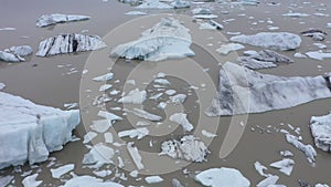 Aerial view of melting glacier and floating icebergs as result of Atlantic ocean meridional overturning circulation collapse