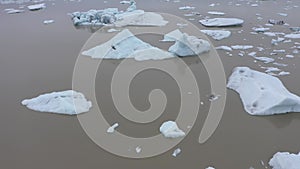 Aerial view of melting glaciers and icebergs in alarming rate in Antarctica. Climate change and global warming