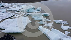 Aerial view of melting glaciers and icebergs in alarming rate in Antarctica by drone. Climate change and global warming
