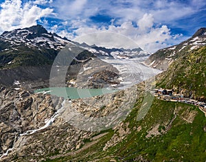 Aerial view of the melting Rhone glacier and the glacial lake in the Swiss Alps