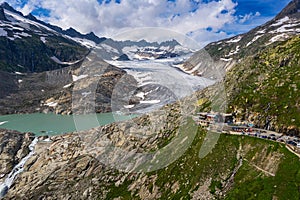 Aerial view of the melting Rhone glacier and the glacial lake in the Swiss Alps