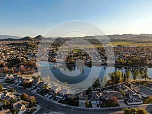 Aerial view of Menifee Lake and neighborhood, residential subdivision vila during sunset.