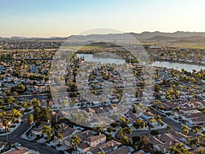 Aerial view of Menifee Lake and neighborhood, residential subdivision vila during sunset.