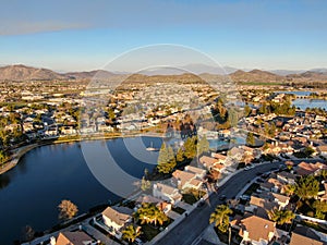 Aerial view of Menifee Lake and neighborhood, residential subdivision vila during sunset.