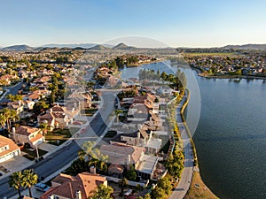 Aerial view of Menifee Lake and neighborhood, residential subdivision vila during sunset.