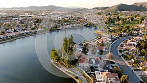 Aerial view of Menifee Lake and neighborhood, residential subdivision vila during sunset.