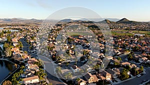 Aerial view of Menifee Lake and neighborhood, residential subdivision vila during sunset.