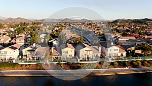 Aerial view of Menifee Lake and neighborhood, residential subdivision vila during sunset.