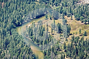 Aerial view of Merced river flowing through evergreen forests in Yosemite Valley, Yosemite National Park, Sierra Nevada mountains