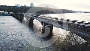 Aerial view of the metro bridge in Kiev, Ukraine. Lively traffic. Shooted at different speeds - normal and fast