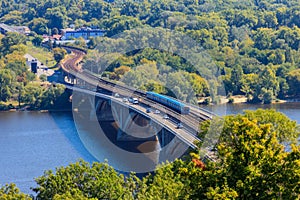 Aerial view of Metro bridge with subway train passing and the Dnieper river in Kiev, Ukraine