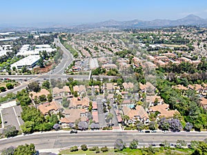 Aerial view middle class neighborhood with condo community and residential house, South California