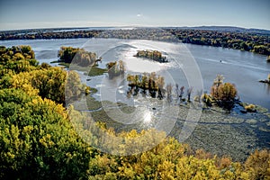 Aerial view of the Milles Iles river in Laval, Quebec at sunset with colorful trees in Autumn