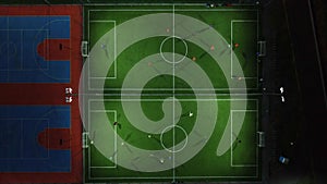 Aerial view of a mini football match, soccer. MiniFootball field and Footballers from drone