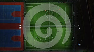 Aerial view of a mini football match, soccer. MiniFootball field and Footballers from drone