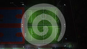 Aerial view of a mini football match, soccer. MiniFootball field and Footballers from drone