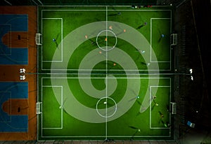 Aerial view of a mini football match, soccer. MiniFootball field and Footballers from drone