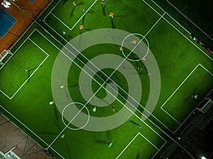 Aerial view of a mini football match, soccer. MiniFootball field and Footballers from drone