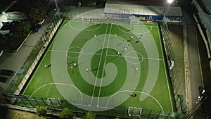 Aerial view of a mini football match, soccer. MiniFootball field and Footballers from drone