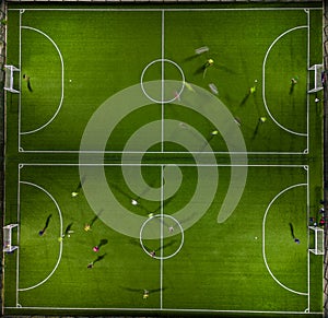 Aerial view of a mini football match, soccer. MiniFootball field and Footballers from drone