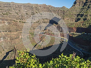 Aerial view from Mirador de la curva del queso. Green valley of Valle Gran Rey with mountain cliffs, ocean and colorful