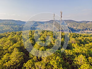 Aerial view of mobile phone antenna station tower in Swiss alps. Wireless communication in mountain area