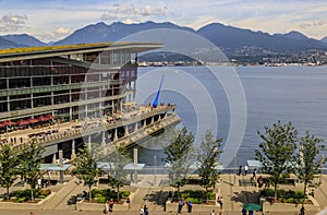 Aerial view of modern architecture at Burrard Landing, Convention Center and harbor with mountains in Vancouver, Canada