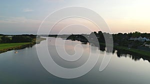 Aerial view of modern buildings near the lake at sunset