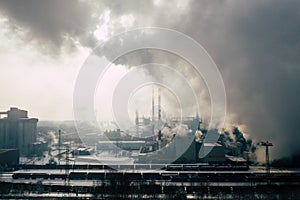 Aerial view of modern combined heat and power plant. Fuming chimney. Heavy industry from above. Power and fuel generation in